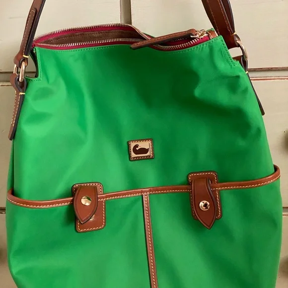 I have a few Dooney & Bourke handbags I never use anymore  Never use Dooney & Bourke tote bag display picture 1